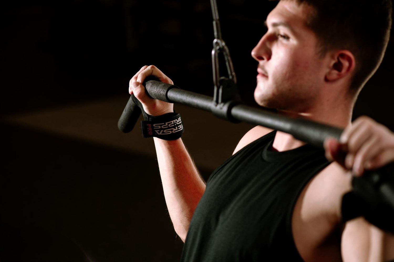 Man doing resistance training with Versa Gripps